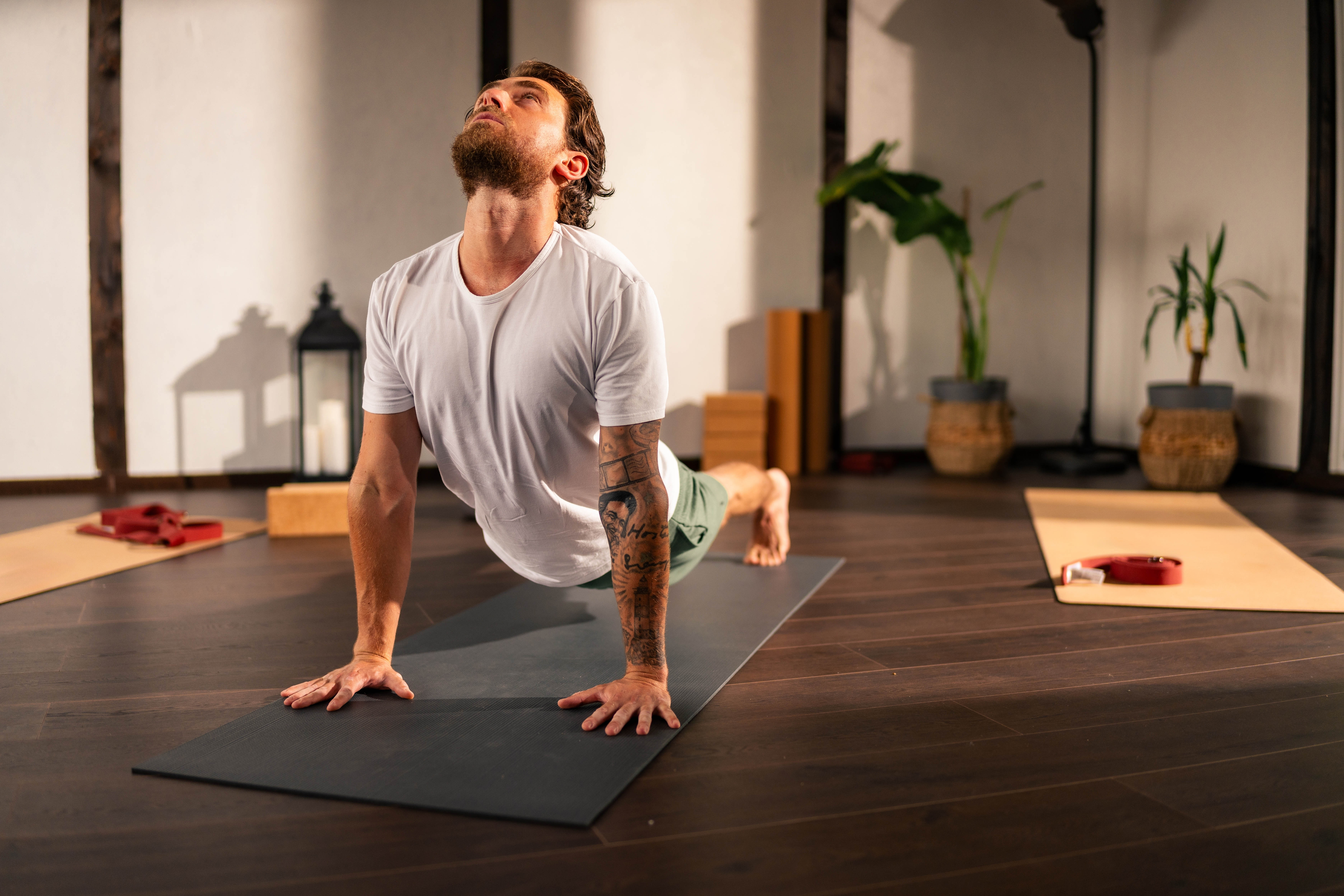 Man doing yoga at the gym